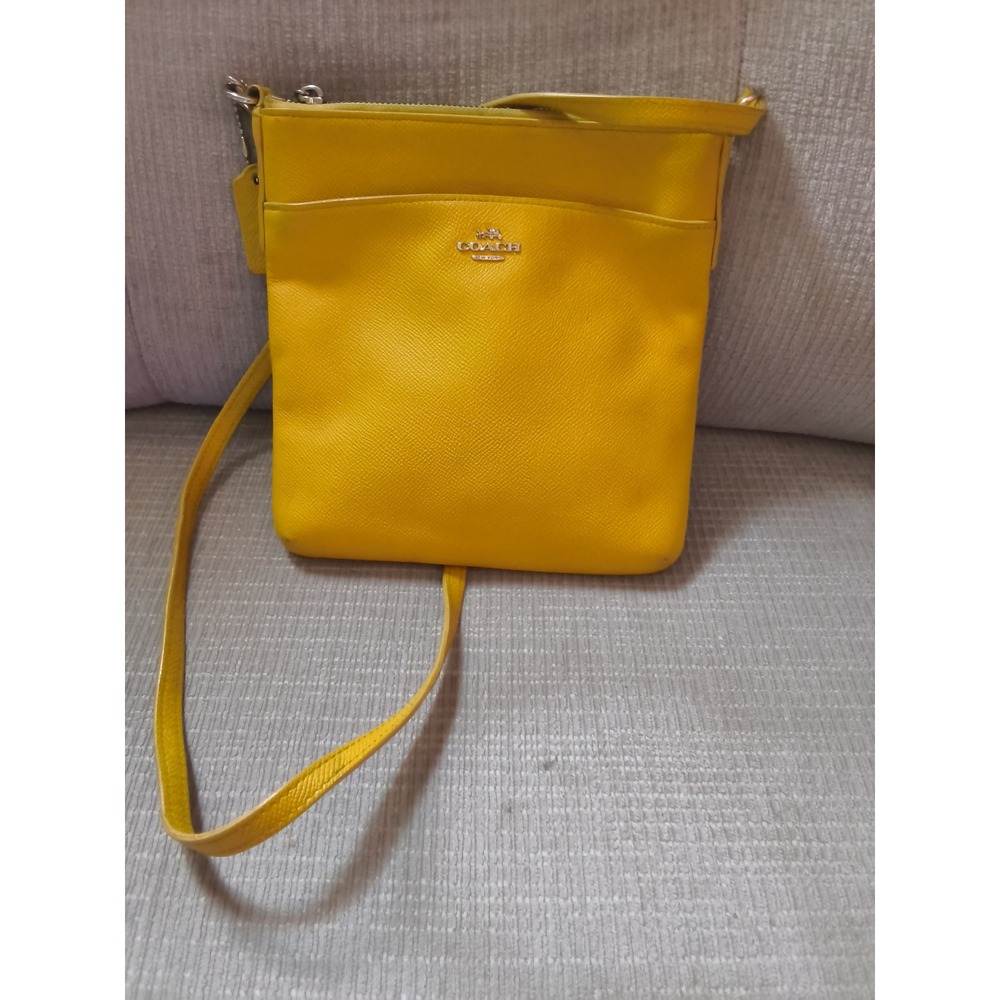 59. Coach North South Swingpack Yellow Crossgrain Leather Crossbody Bag F52657